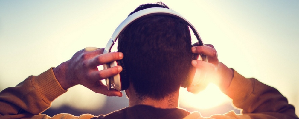 Male-Gen-Z-listening-to-music-through-headphones Male-Gen-Z-listening-to-music-through-headphones