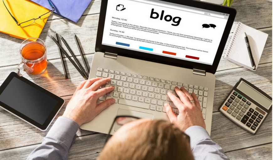 businessma-writing-blog-post-on-laptop businessma-writing-blog-post-on-laptop